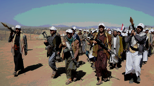 Houthi fighters march in Yemen