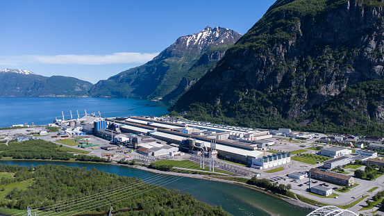 Aerial view of the Hydro Norse aluminium production facility placed in a beautiful landscape