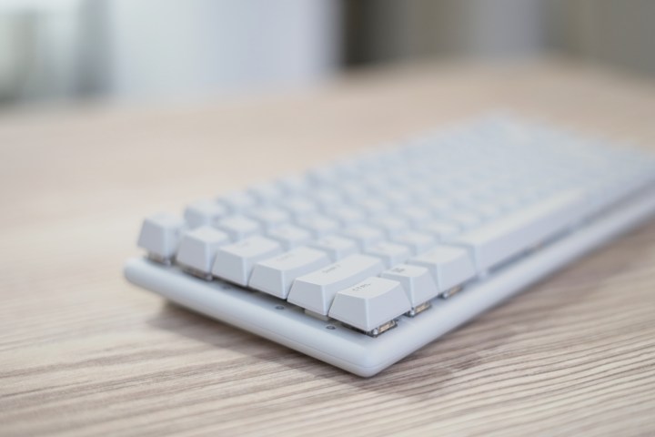 The Alienware Pro Wireless Keyboard on a wooden table.