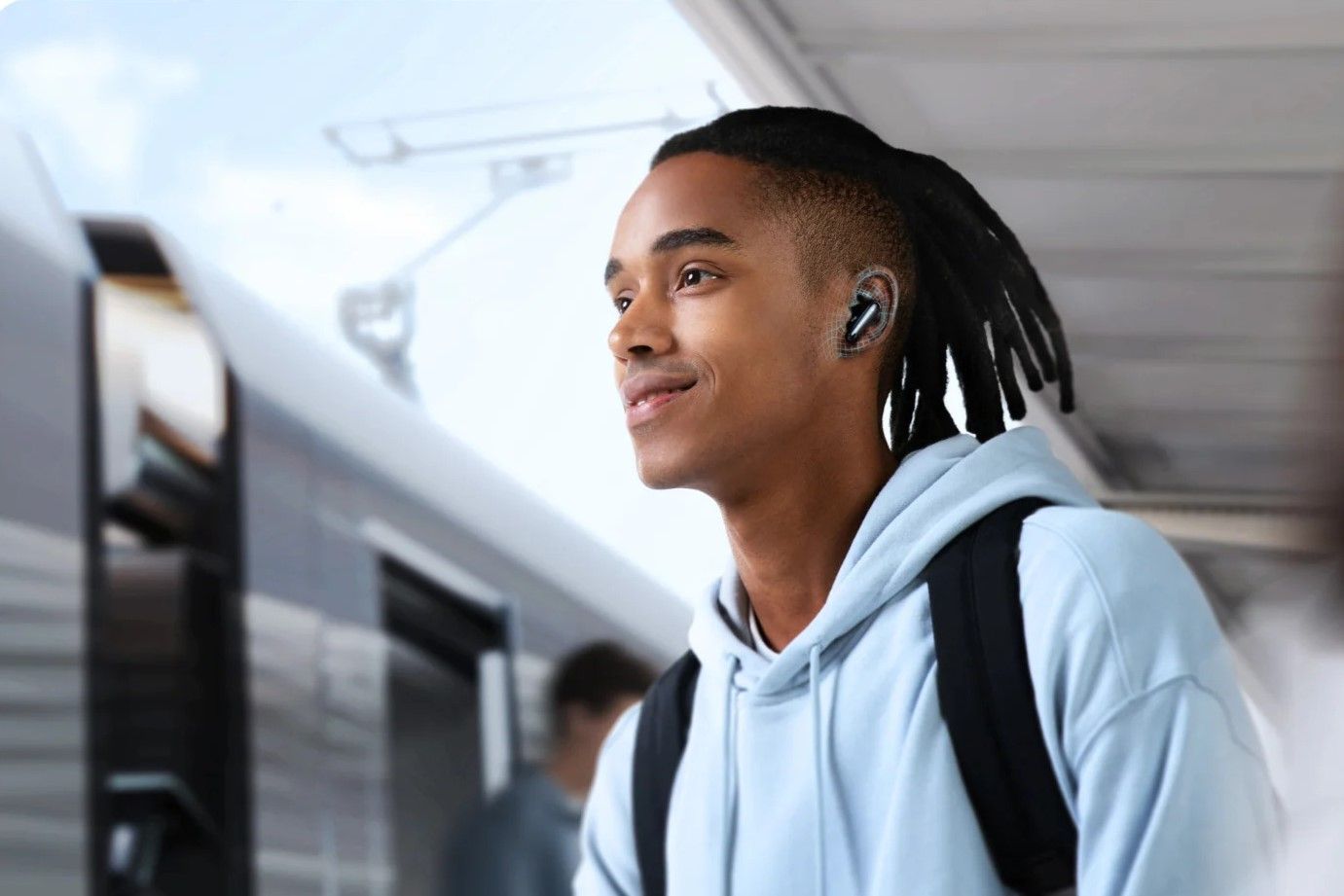 A man listening to music on the soundcore liberty 4 NC