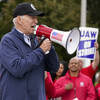 Autoworkers get a historic visitor to the picket line: President Biden