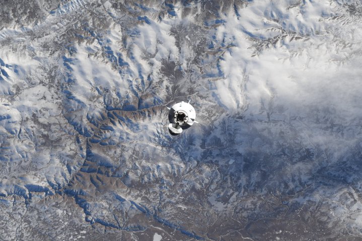 A SpaceX Crew Dragon approaching the ISS in the Axiom-3 mission.