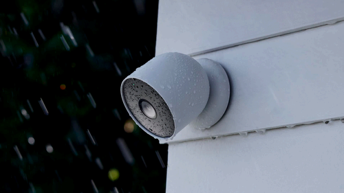 A photo of the Nest Cam Battery mounted outside a home.