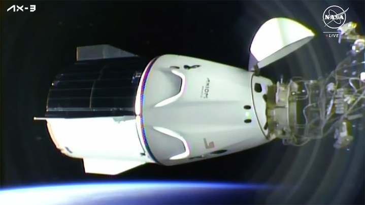 The SpaceX Dragon Freedom spacecraft carrying four Axiom MIssion 3 astronauts is pictured docked to the space station shortly after an orbital sunrise.