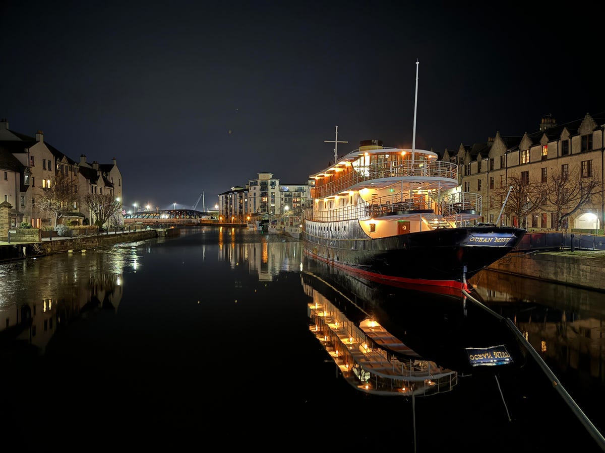 a photo of a boat at night