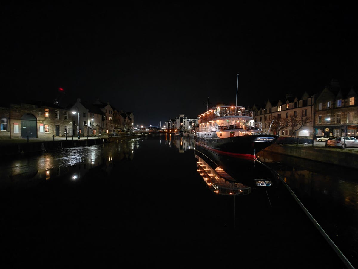 a photo of a boat at night