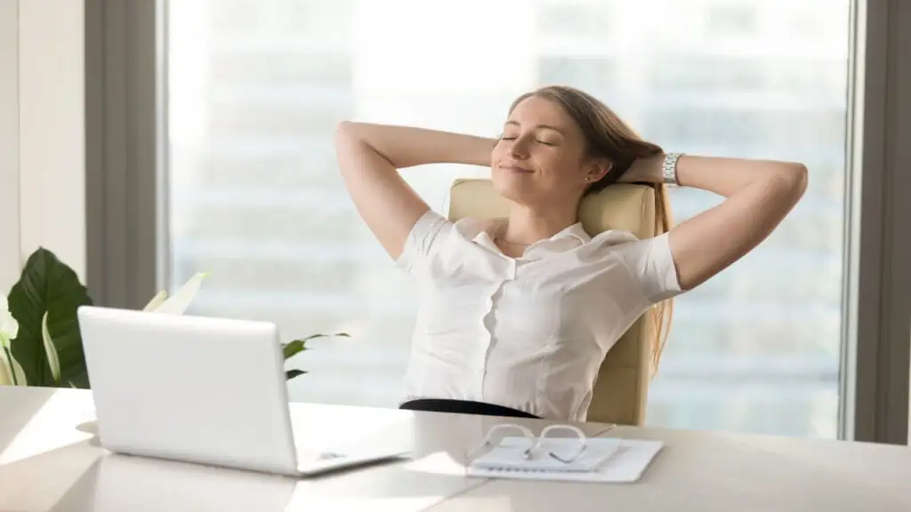 woman relaxing using retirement calculators