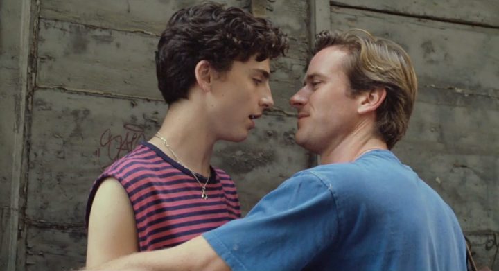 Timothee Chalamet and Armie Hammer hug and look into each other's eyes in Call Me By Your Name.