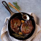 A cast-iron pan with food in it