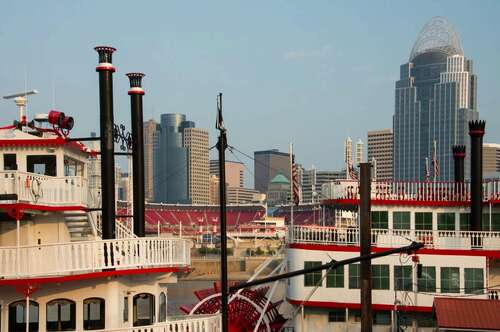 Cincinnati, Ohio, at sunrise with sternwheelers in the foreground.