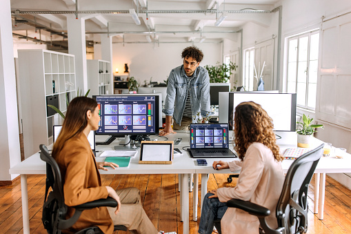 Colleagues analysing cryptocurrency at the office