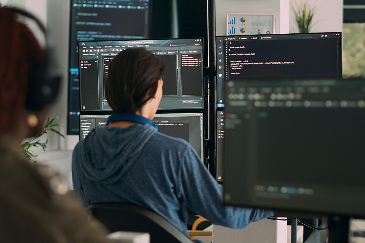 An embedded systems engineer programming on his computer.