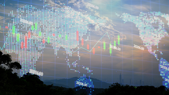 Fast changing stock market candlestick chart on holographic world map.