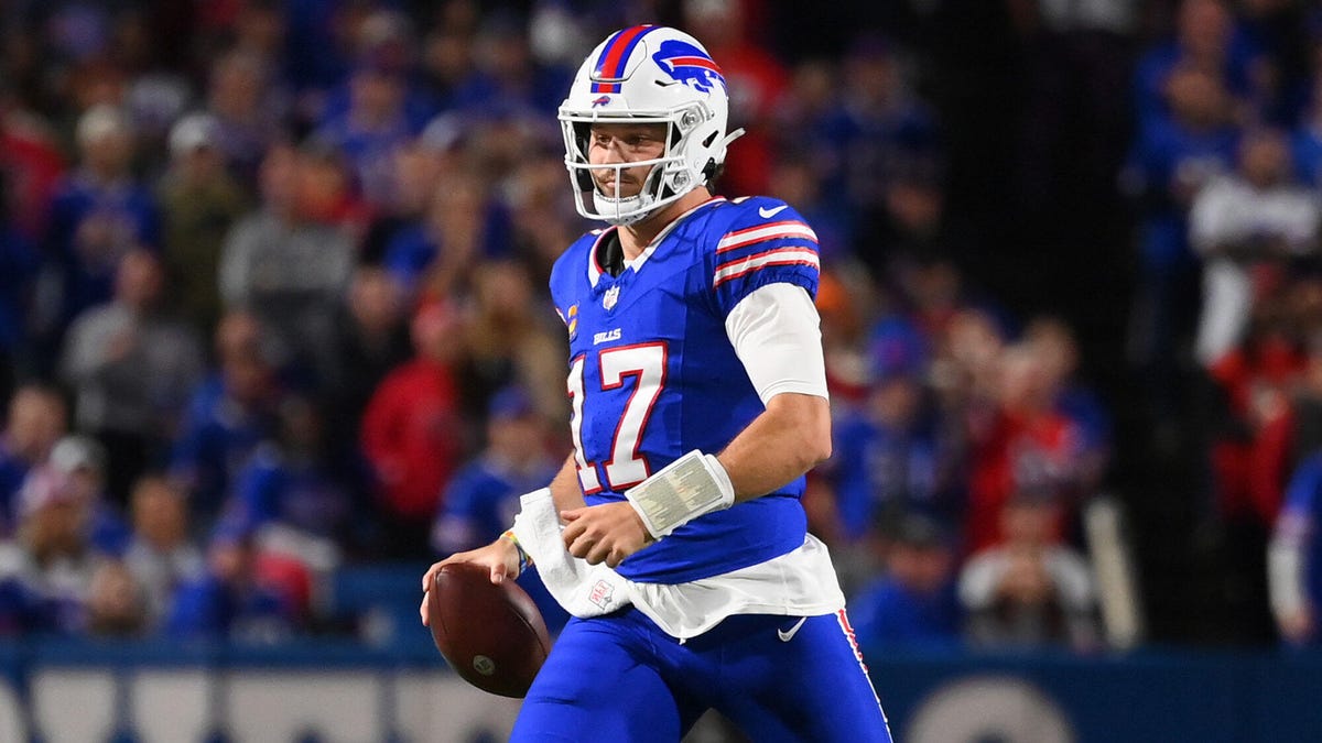 Josh Allen of the Buffalo Bills, holding the ball in his right hand.