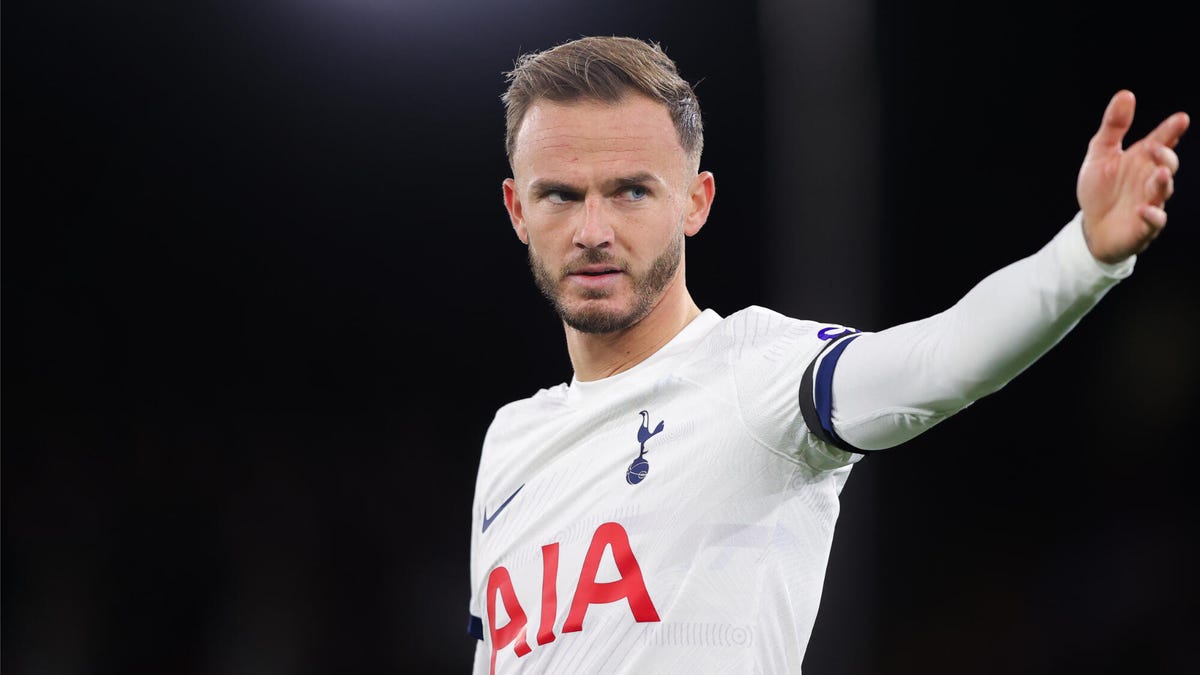 James Maddison of Tottenham Hotspur with his left arm outstretched.