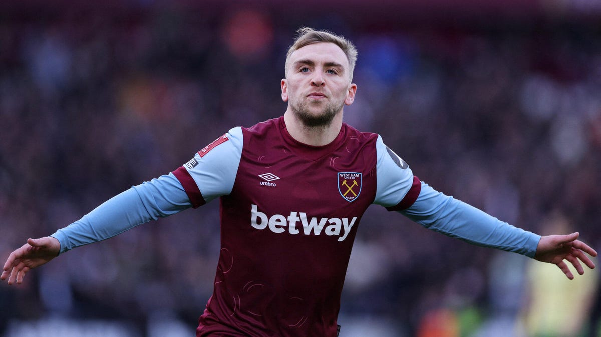 West Ham United forward Jarrod Bowen celebrating, arms outstretched.