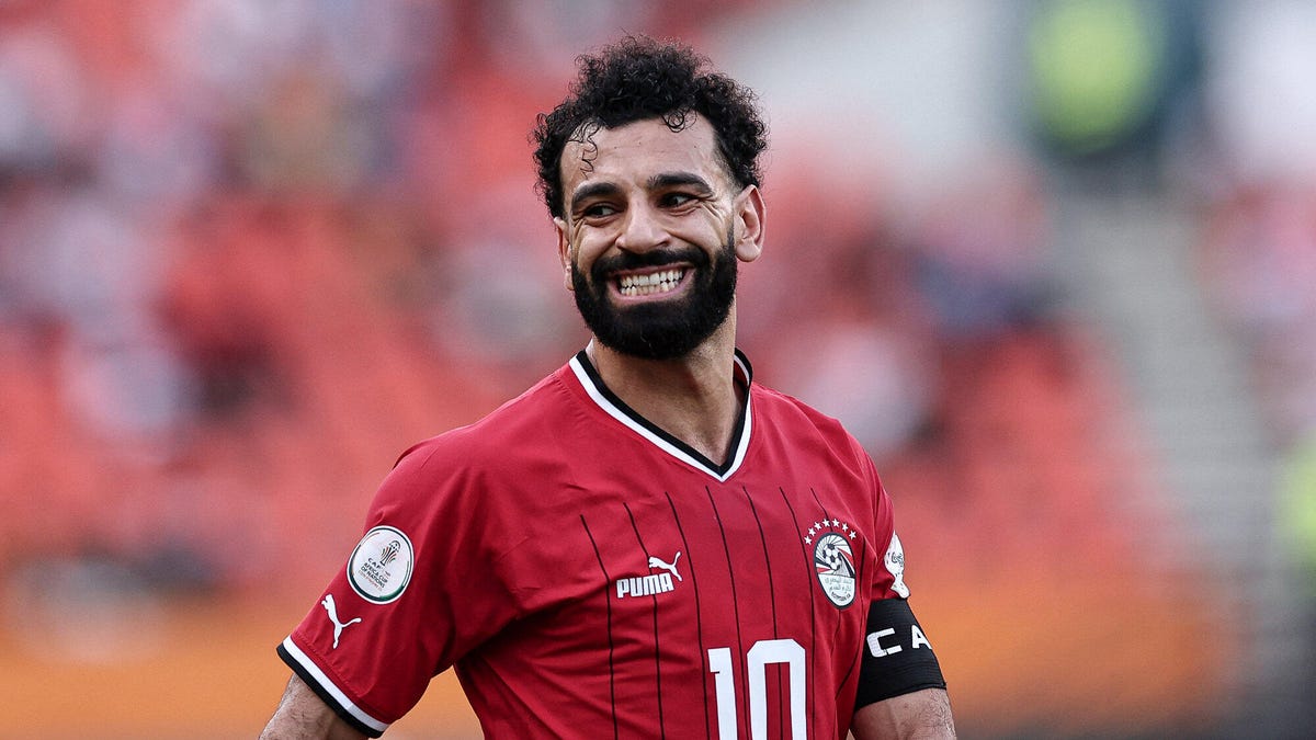 Egypt forward Mohamed Salah wincing, looking towards his right hand side.