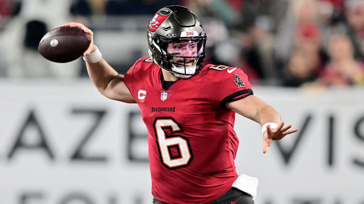 Baker Mayfield of the Tampa Bay Buccaneers, arms outstretched, preparing to throw the ball with his right arm.