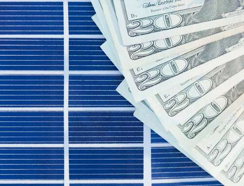 Solar panels with a wad of cash