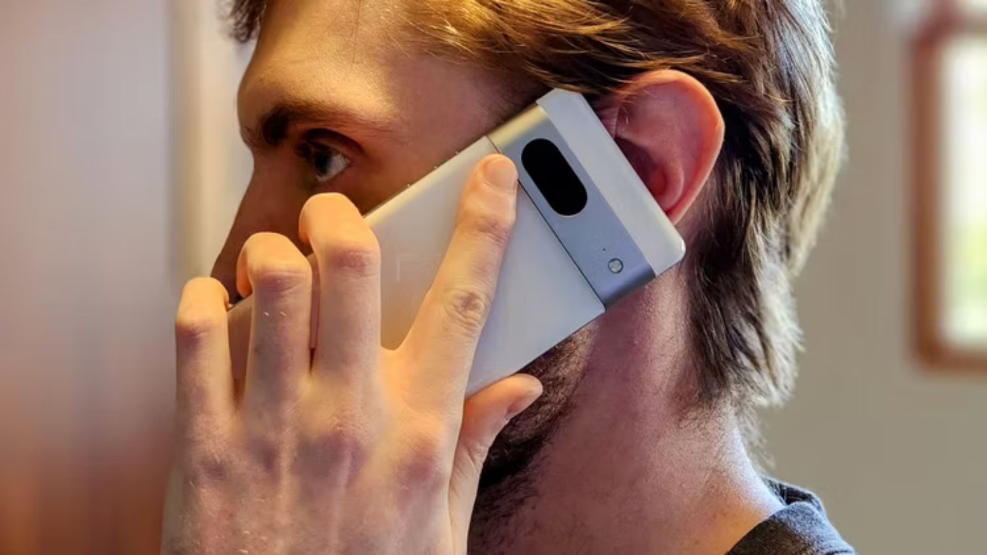 Man talking on a Pixel 7 phone. 