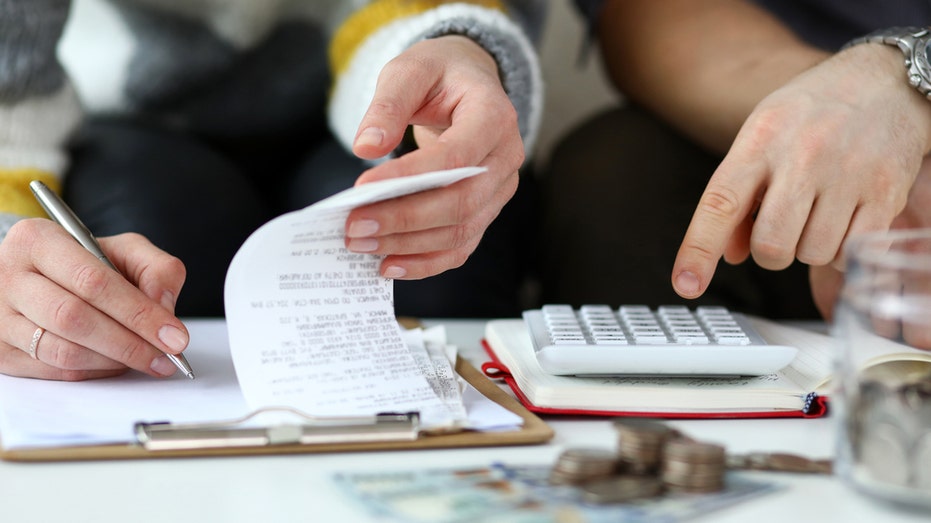 Man and woman look over finances.