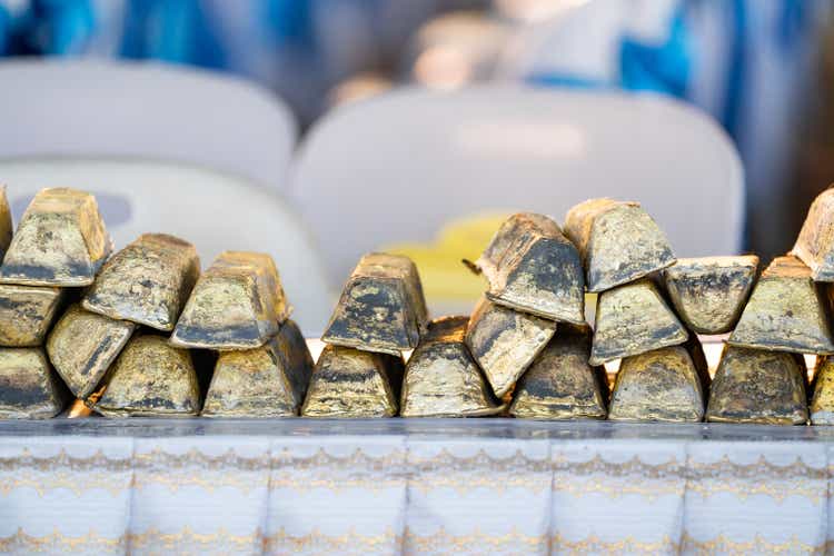 Stack gold bars for making merit and casting Buddha statue were placed in a mess.