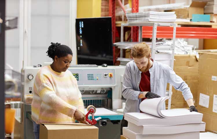 Workers Doing Quality Control at Printing Factory