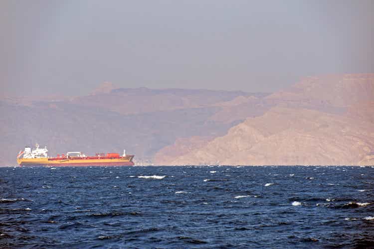 Freighter makes headway towards the Red Sea port of Aqaba, Jordan with Sinai Desert behind