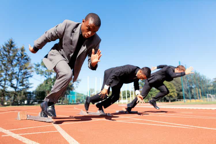 100 meter start in business suits