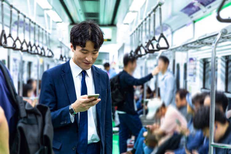 Businessman commuting by bicycle in Seoul - South Korea