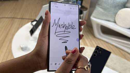 Woman holding Samsung Galaxy S24 Ultra with S Pen