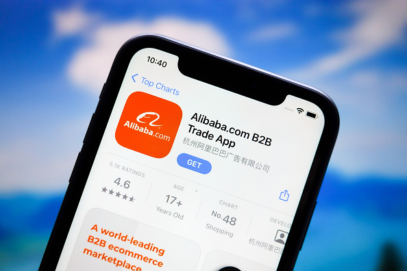 In this photo illustration, the Alibaba app logo is...