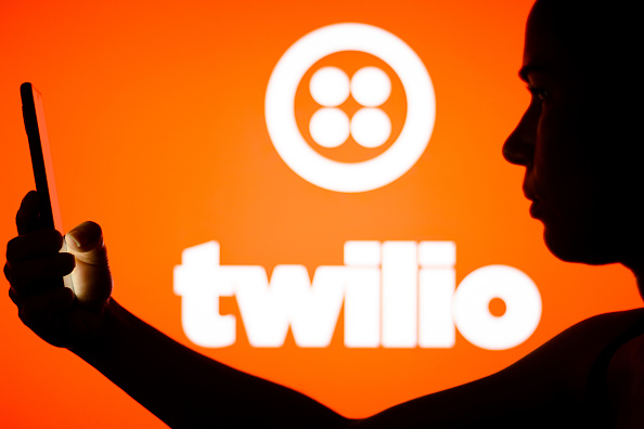 In this photo illustration, the Twilio logo is seen in the...