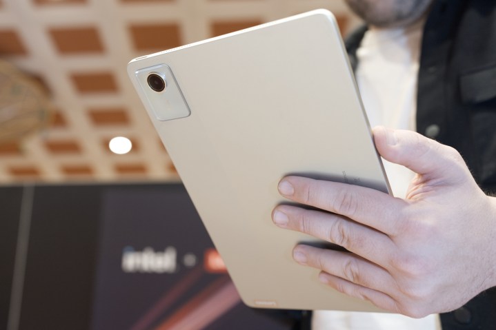 Someone holding the Lenovo Tab M11.