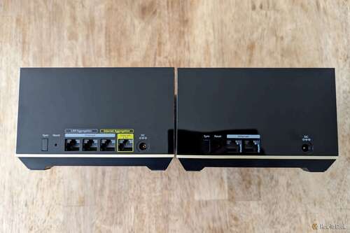 Ports on the back of a Netgear Nighthawk MK93S main router and satellite unit.