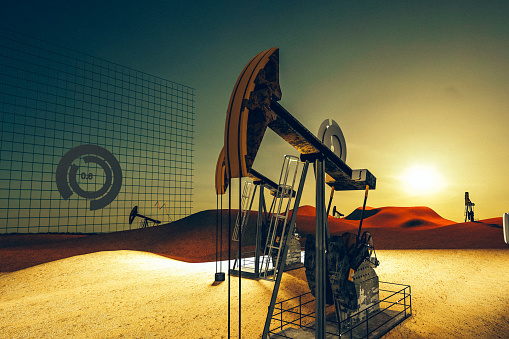 Oil field in the desert at sunset, Drilling rig and pump operation, financial graph, statistics, rates, numbers, charts on the background