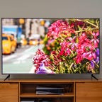 Roku TV on a wooden TV cabinet