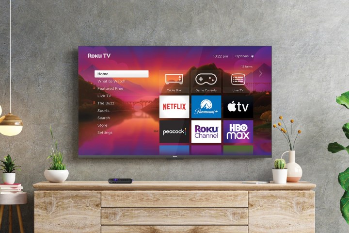 A Roku powered TV hanging on a wall running Roku OS 12.