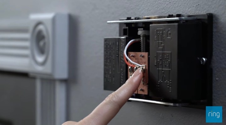 A person checking their chime while installing a Ring doorbell.