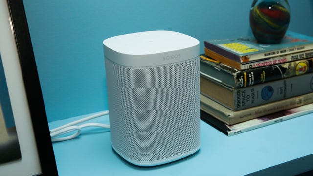 Sonos One on a bookshelf