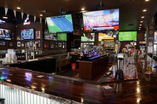 Tilted TVs in a Utah sports bar.