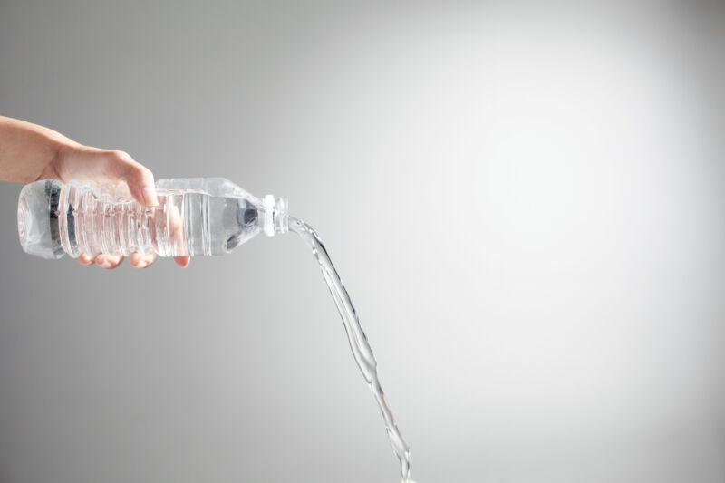 water being poured from a water bottle