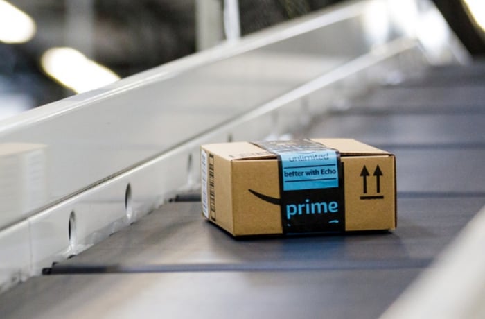 Close-up of an Amazon box on a conveyor belt.