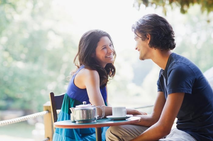 Young couple look at each other with affection