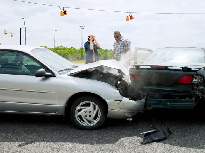 Car accident between two vehicles on the road.