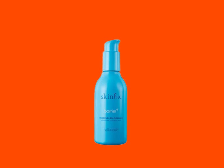 Skinfix barrier oil cleanser on an orange background