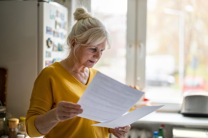 Person studying documents.