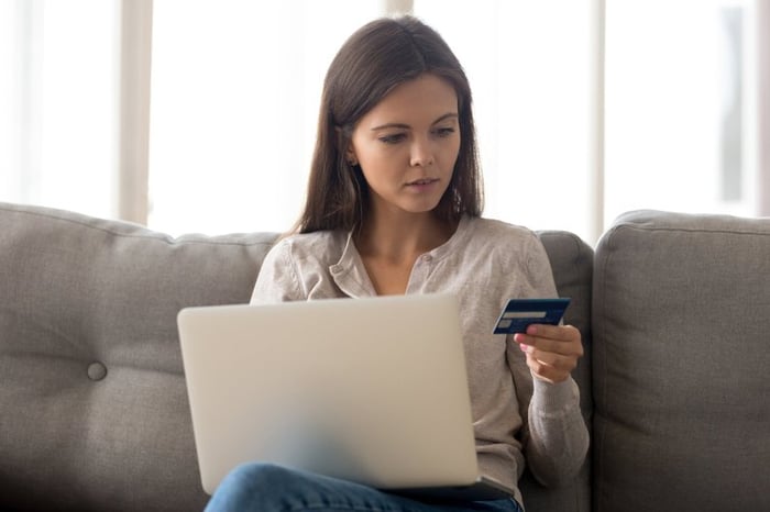 Woman with credit card laptop