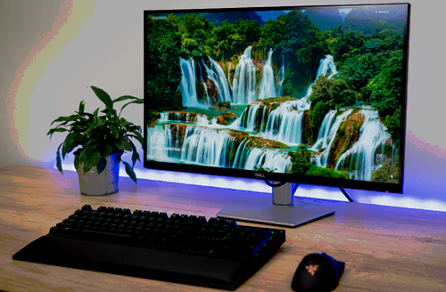 The 27-inch Dell S2721QS 4K monitor on a table.