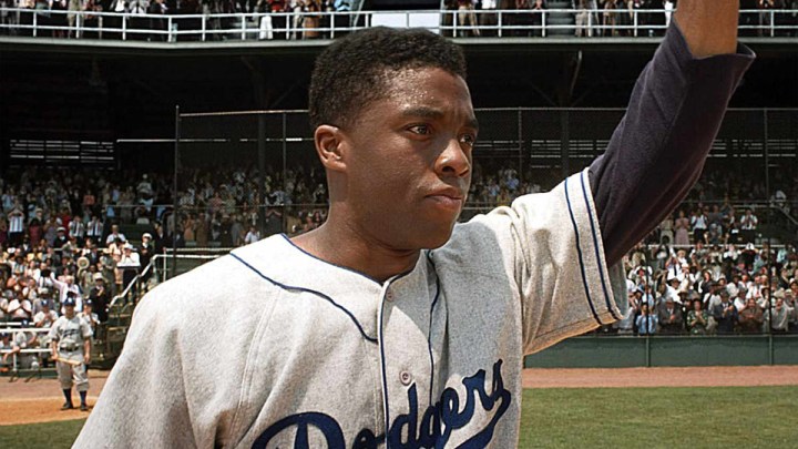 Chadwick Boseman as Jackie Robinson in 42.